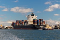 cargo ship on sea under blue sky during daytime